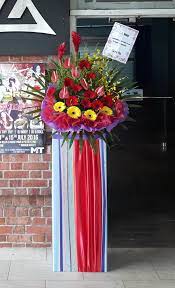 80 Grand Opening Flowers With Yellow And Red Gerberas With Anturiums And Ginger Flowers Flower Arrangements Making A Gift Basket Floral Bouquets