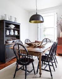 The sturdy farmhouse dining chair adds a little bit of country style to any dining area. A Victorian Farmhouse Brings Modern Flair To The Country Upcycled Dining Chairs Dining Chairs Black Dining Chairs