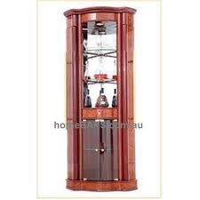 The corner bar cabinet stands out from the rest with a neatly fitting into a corner, it brings modern style to your living room. Corner Pull Out Bar Cabinet Maple Small 1 Home Bars