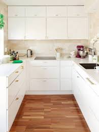 modern kitchen cabis and gold brass