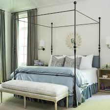 We love the white iron sleigh bed and its charming, feminine design which surely stands out gorgeously in this rustic chic bedroom. Photos Hgtv