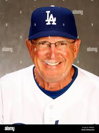 Los Angeles Dodgers bullpen coach Chuck Crim (50) talks to pitcher Ronald  Belisario (54) and catcher Tim Federowicz during the eigth inning of a  baseball game against the Toronto Blue Jays Tuesday,