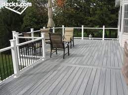 Gray Deck With White Posts And Black Spindles Grey Deck Building A Deck Deck Pictures