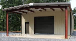 Tan Metal Building With Open Bay Used As A Workshop Garage Renegade Steel Buildings Metal Shop Building Metal Buildings Steel Building Homes