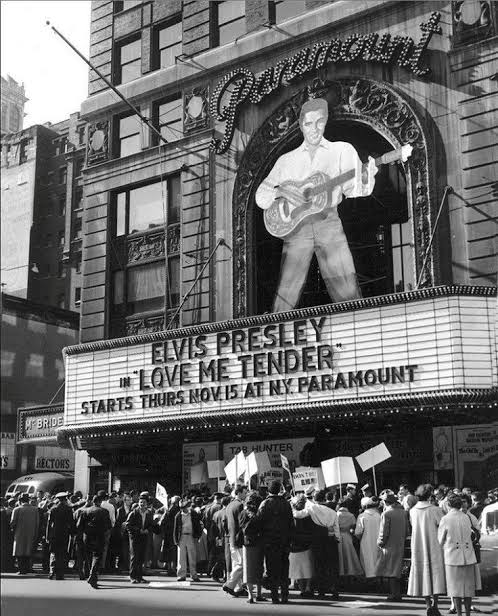 Crowds outside the Paramount Theater in New York City, await the premier of  Elvis's first film, Love Me Tender, on Nov. 15, 1956.