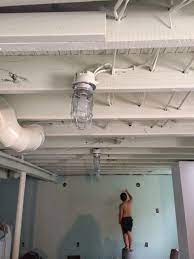Digging out your basement to give you higher ceilings is an expensive endeavor. Painted Basement Ceiling Alternative To Drop Ceiling Diy Finished Basement Basement Ceiling Diy Finish Basement Finishing Basement