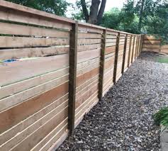 Horizontal slat railing brushed steel. Custom Wood The American Fence Company