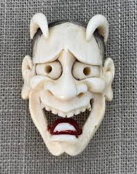 Sold at Auction: A BOXWOOD NETSUKE OF A MONKEY ON A BAMBOO SHOOT