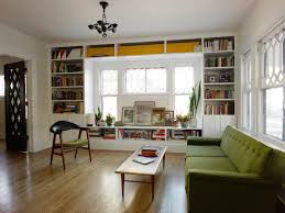 I think we could put this in the workout area and use the bookcase as part of the room divider. Shelves Around Windows Houzz
