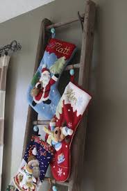 No house is complete without personalized christmas stockings hanging by the fireplace (or some other hearth of the home) waiting for a visit from santa! No Fireplace No Problem Holiday Decor For Those Without A Chimney The Interior Collective Christmas Stockings Hanging Christmas Stockings Hanging Stockings
