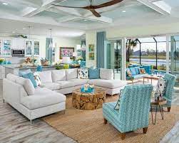 When you think of beach cottage decor, white architectural elements of a beach cottage style include white beadboard walls and ceilings. Coastal Home Design Beach Decor With Latitude At Margaritaville Retirement Communities Coastal Decor Id Beach House Decor Coastal Living Rooms House Design