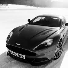 Sleek Black And White Aston Martin Dbs Aston Martin Aston Martin Cars Aston Martin Dbs