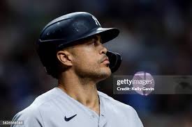 Aaron Boone of the New York Yankees blows a bubble during batting... News  Photo
