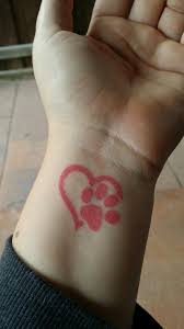Traditionally it has been known as a symbol of love since its introduction to the tattoo world. Pink Heart With Paw Print Wrist Tattoo Paw Pawprint Pawtattoo Pinktattoo Tattoo Wristtattoo Hearttattoo Pawprint Tattoo Print Tattoos Paw Print Tattoo