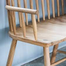 Finished with oil to bring out the beautiful grain of the oak and to offer your furniture protection from spillages and scratches. Alpine Contemporary Spindle Back Oak Loveseat Bench Hall Bench