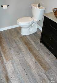 Ceramic tile and vinyl flooring are some of the easiest bathroom floors to maintain. Plank Tile Bathroom Flooring Happihomemade With Sammi Ricke