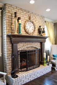 This red brick fireplace was hardly used except for collecting dust and random items. Red Brick Fireplace With White Mantel Repainted For A Cozy Feel Love Eating In Front Of Red Brick Fireplaces Brick Fireplace Mantles Brick Fireplace Makeover