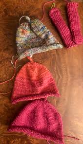 I do this by pressing the first stitch on the left needle (the one closest to the tip) against the needle using the middle finger of my left. Knitting With Love Knit The Hell Out