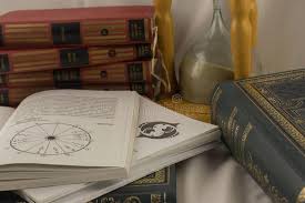 Astrology Books And Hourglass In Psychic Office Editorial