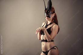 submissive redhead woman in bdsm bunny mask Stock Photo | Adobe Stock