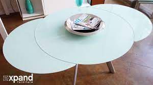 Extendable dining, kitchen and office conference tables to mobile kitchen serving carts. The Butterfly Expandable Round Glass Dining Table Expand Furniture Folding Tables Smarter Wall Beds Space Savers