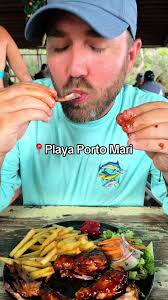 Discover Playa Porto Mari: Beach, Pigs, and Delicious Food!