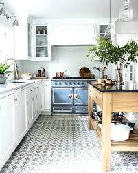 Bright, white cabinets bounce light and make for a modern kitchen. Kitchen Kitchen Floor Tile Ideas With White Cabinets