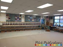 Ukulele Storage In The Music Classroom On The Wall Racks More The boom microphone allows the student to hear their responses through the headphone.