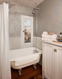 Give your bathroom a touch of glam by choosing a glossy black clawfoot tub accented with striking gold feet. Small Bathroom With Clawfoot Tub Design Novocom Top