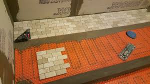 Lift up a corner of the matting to check coverage. Heated Shower Tile Floor Installation With Ditra Heat Touchdown Tile
