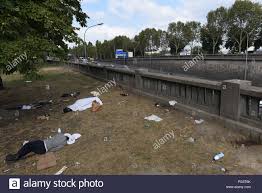 August 14 2018 Paris France Migrants Sleep In A Public Park Near The Peripherique Ring Road