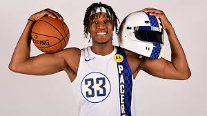 The jersey is primarily white with a blue and black chequered flag trim on the left hand side of the jersey. Pacers Unveil City Edition Uniforms Nba Com