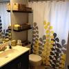 Yellow shower curtain and rug set. 1