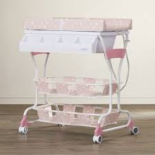 The ingenious design of the bathtub and the changing table relax the spine of the parents. Found It At Allmodern Saige Deluxe Bathtub And Changer Combo Diaper Changing Table Baby Changing Changing Dresser