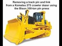 Removing a track link pin on a Komatsu 275 dozer