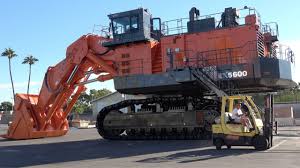 A man carrying shovels … wikipedia. The World S Largest Machines Hitachi Ex5600 Face Shovel Youtube