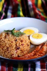 Sometimes soft boiled eggs are eaten in the shell, stood upright in little egg cups. Thai Chili Paste Fried Rice Boiled Egg And Sweet Shrimp On White Plate And Space For