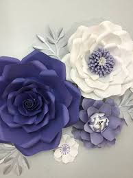 Group tissue paper flowers together in an arrangement, and add leaves for an instant bloom of happiness! Why Just Add A Canvas To Your Nursery Wall When These Paper Flowers Will Add Depth And Dimensio Giant Paper Flowers Paper Flowers Paper Flower Backdrop Wedding