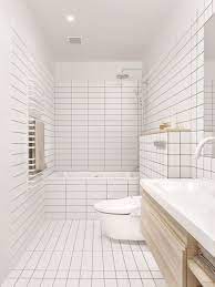 But did you know there's a difference between the tiles you should use in your kitchen and those for your bathroom? Bathroom Tile Idea Use The Same Tile On The Floors And The Walls White Square And Rectangular Tiles Co Tile Bathroom Minimalist Apartment Bathrooms Remodel