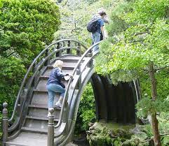 Japanese Tea Garden Moon Bridge A Moon Bridge Is A Highly Arched Pedestrian Bridge A Whimsical Garden Backyard Garden Design Japanese Tea Garden San Francisco