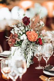 In this flower arrangement tutorial simple flower arranging authors mark welford and stephen wicks show you how to make a wedding centerpiece with white. Floral Pieces Table Decor Fall Palette Burnt Orange Burgundy Flowe Orange Wedding Decorations Orange Wedding Flowers Wedding Floral Centerpieces