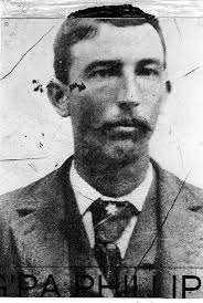 This photo was given to me a number of years ago by a fellow researcher who  is now deceased. The man with the pipe