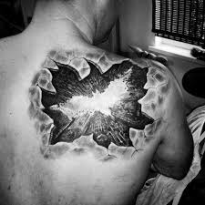 Batman to me(even though he's a fictional character) is the very symbol of human achievement. Ripped Skin 3d Like Black And White Batman Symbol Tattoo On Shoulder Tattooimages Biz