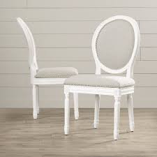 Gray, wood/upholstered chairs/solid wood in gray/white wayfair $ 969.99. Featuring Oval Backs Carved Details And Trendy Nailhead Trim This Alpes Side Chair Lends A Touch Upholstered Dining Chairs Dining Chairs White Dining Chairs