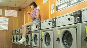 From odor removal tips, laundry room organization, load size guide, and much more. A Young Woman Sits On Stock Footage Video 100 Royalty Free 6440414 Shutterstock