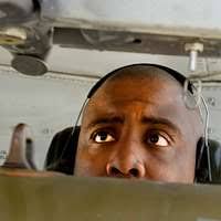Members of the US Navy parachute demonstration team "Chuting Stars,"  prepare for a jump from a CH-46 Sea Knight helicopter