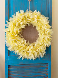 While buying stuff from the dollar store certainly saves you money, you don't necessarily want your home to look like you got everything for a dollar. Make A Fun Sunflower Wreath Out Of Plastic Tablecloths