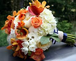 Click on the photograph to enlarge and view Wedding Flowers Orange Flower Centerpieces Wedding