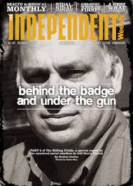 Behind The Badge And Under The Gun