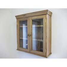 pine 2 door glazed wall cabinet. w70cm.